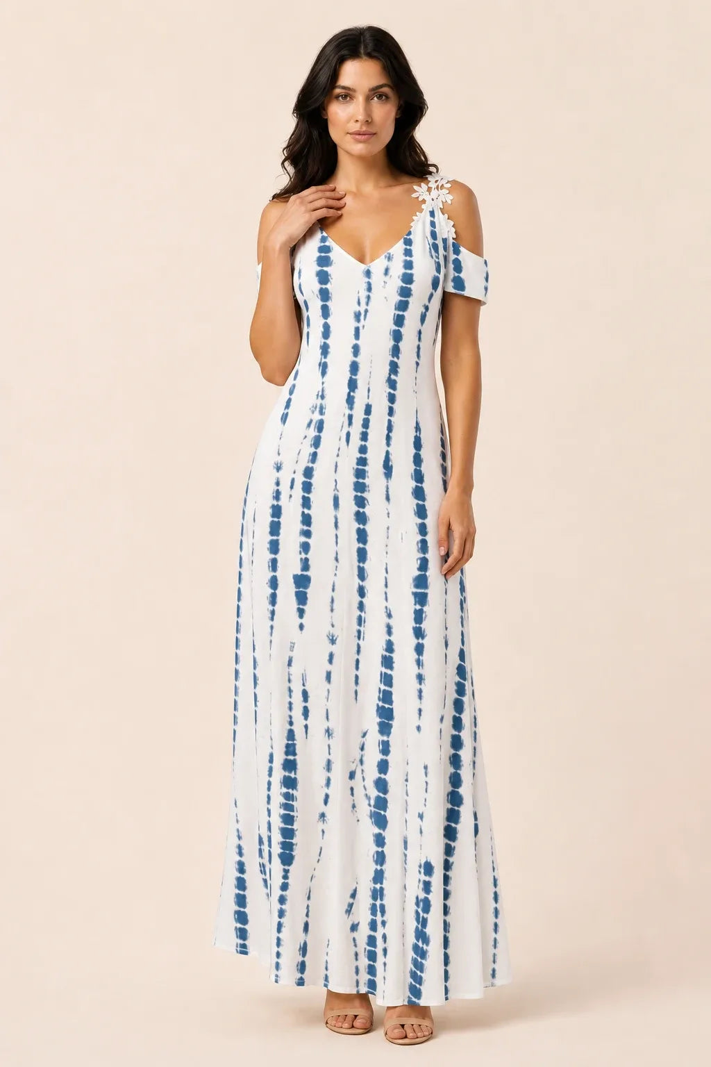 White and blue cold shoulder maxi dress on model in contrapposto stance
