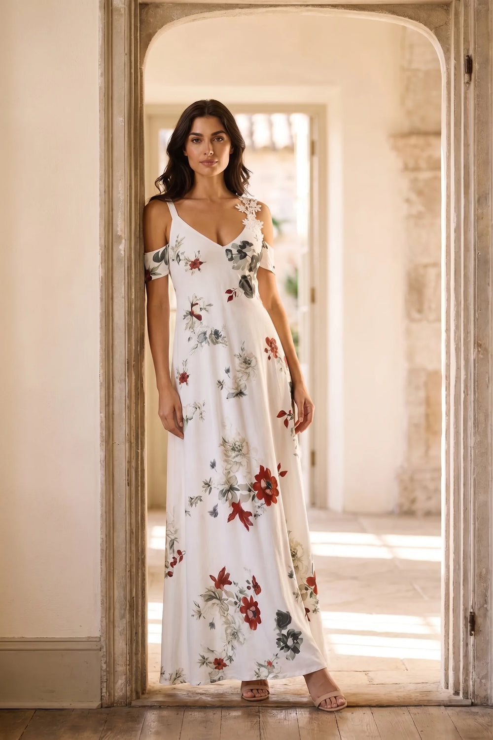 Model wearing white cold shoulder maxi dress in lifestyle setting