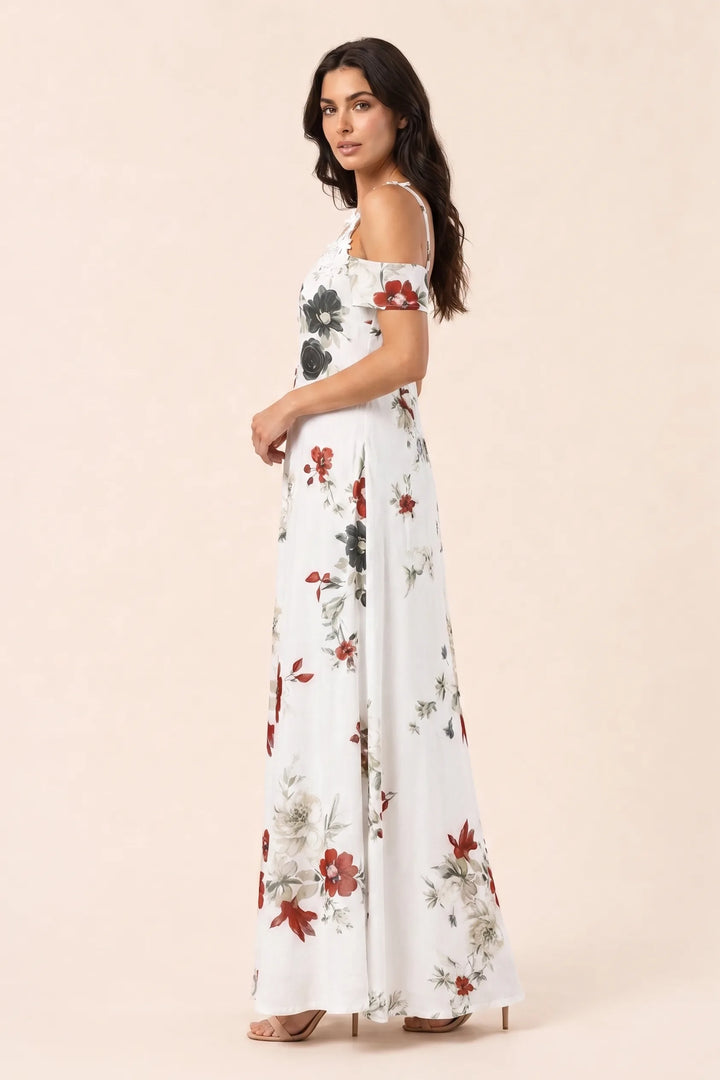 White cold shoulder maxi dress on model in three-quarter turn