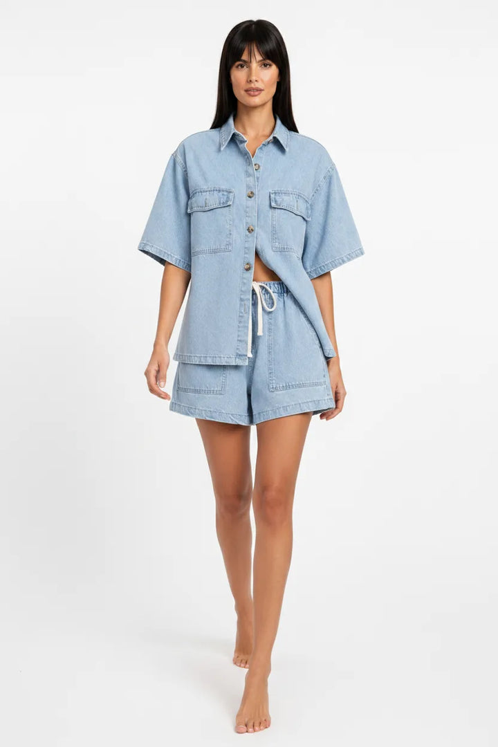 Light blue denim shirt set on model in natural movement pose