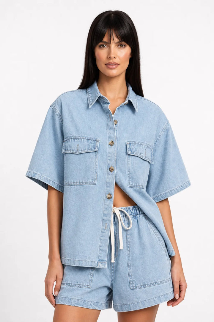 Light blue denim shirt set on model in contrapposto stance