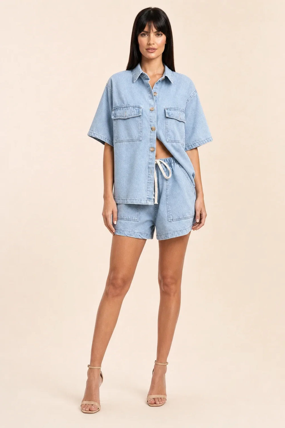Light blue denim shirt set on model in contrapposto stance