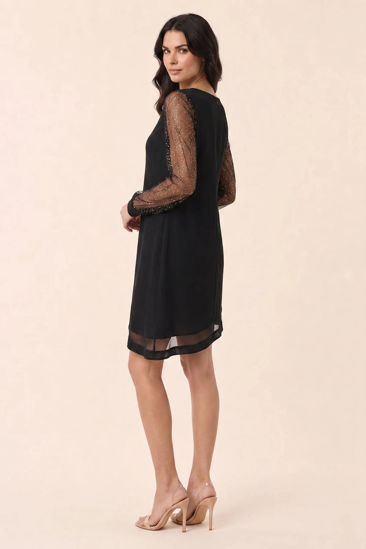 Silver glitter mesh mini dress on model in three-quarter turn