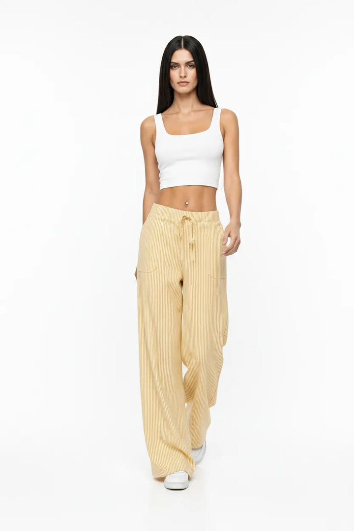 Yellow striped wide-leg pants on a model in natural movement