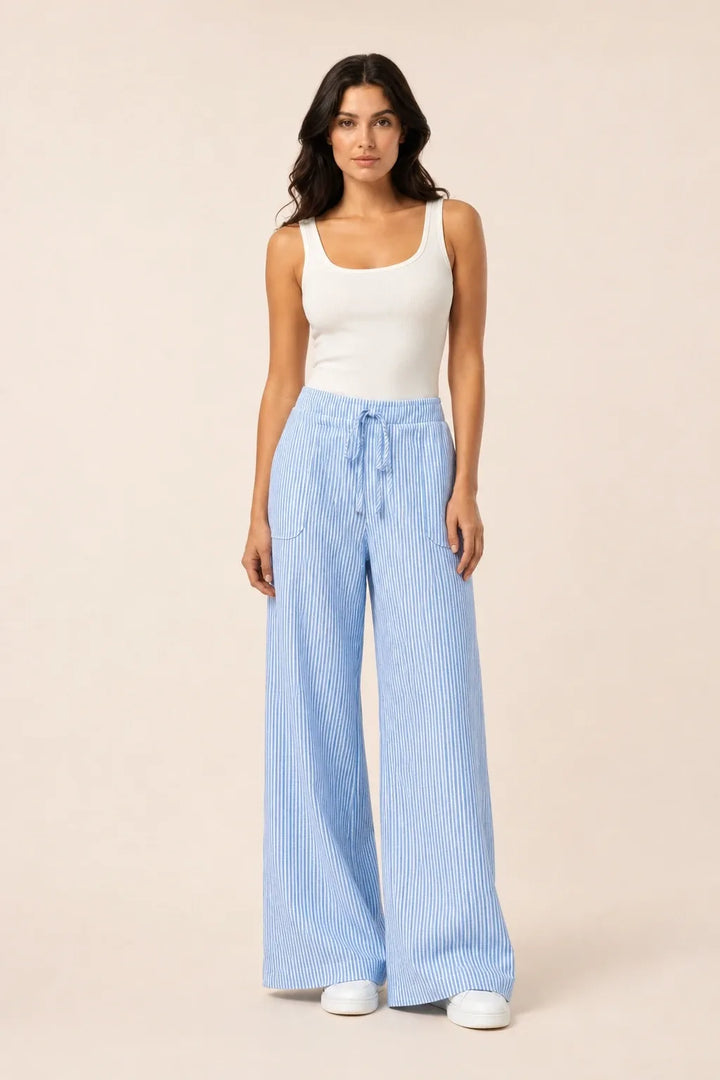 Blue striped wide-leg pants on model in contrapposto stance