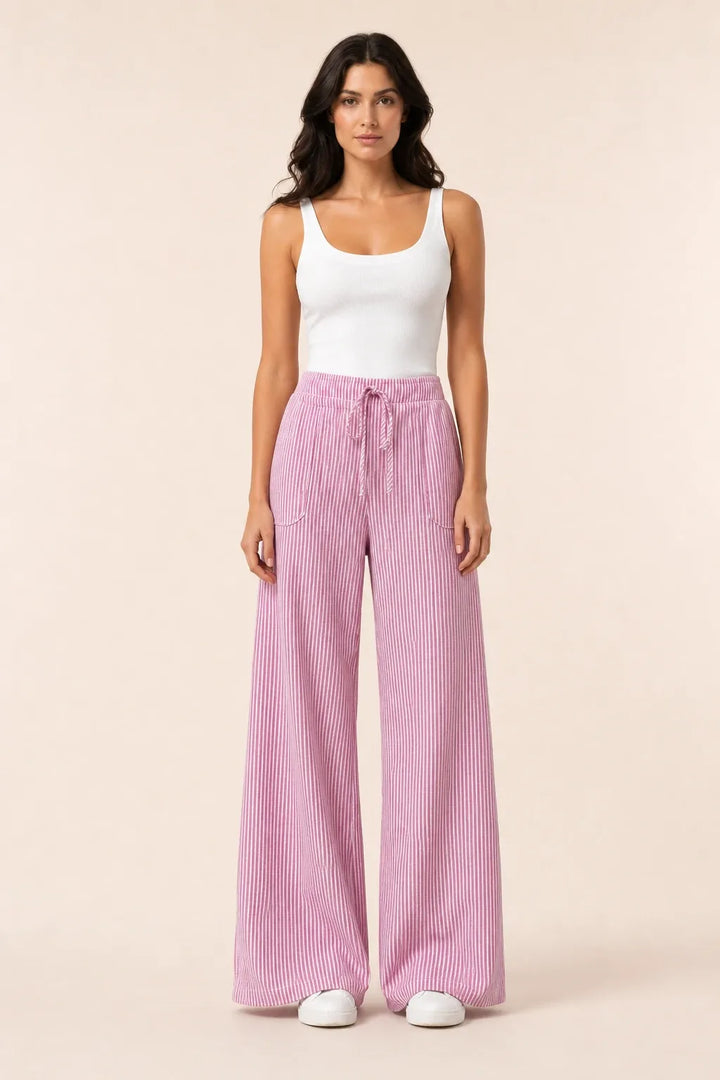 Pink striped wide-leg pants on model in contrapposto stance