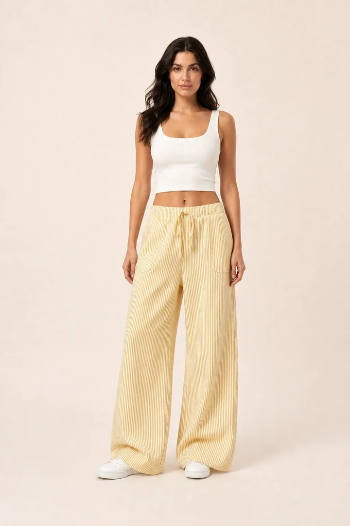 Yellow striped wide-leg pants on model in contrapposto stance
