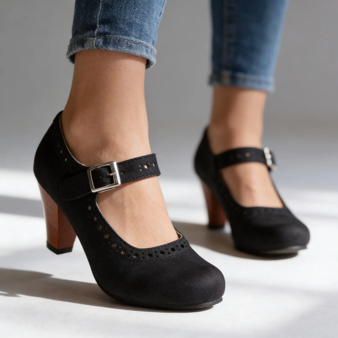 Black mary jane brogue pump, full shoe view showing overall style and construction