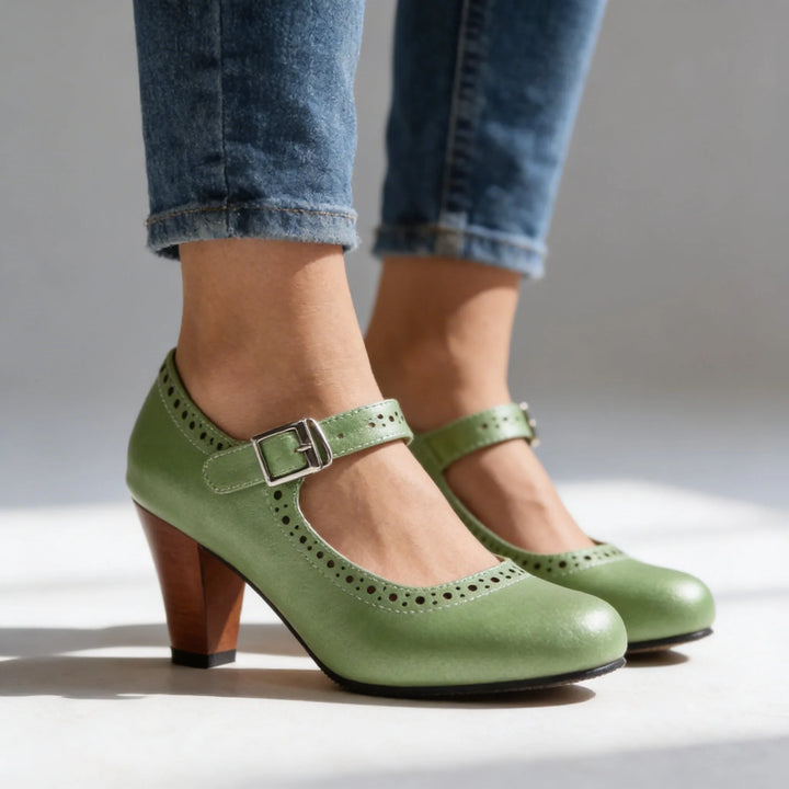 Dark green mary jane brogue pump, full shoe view showing overall style and construction
