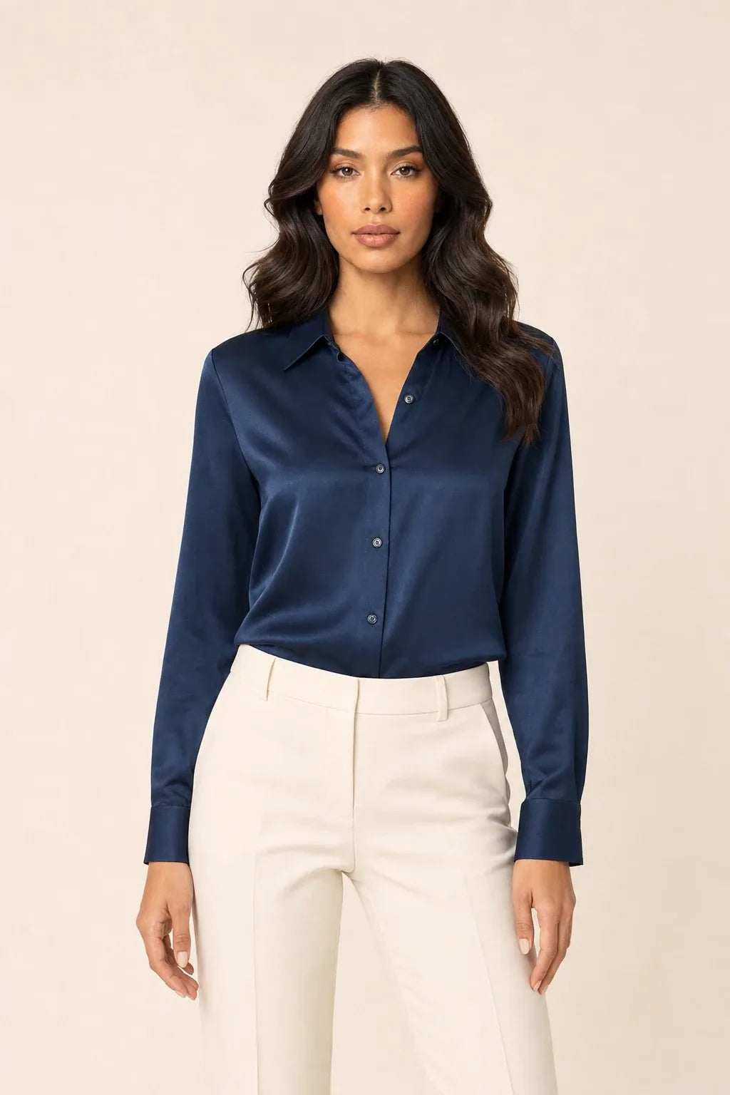 Navy blue satin button-front blouse on model in contrapposto stance