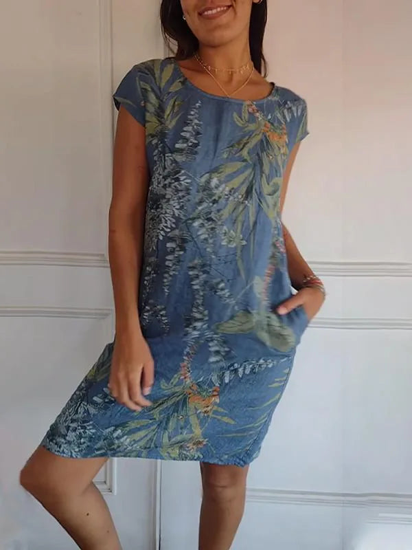 Close-up detail of blue botanical print midi dress