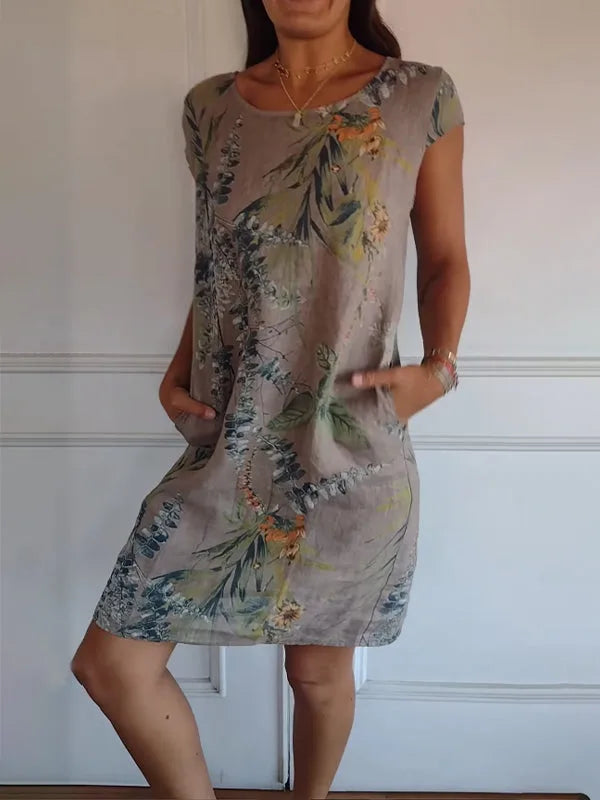 Brown botanical print midi dress on model in side profile