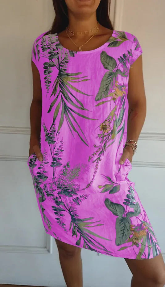 Purple botanical print midi dress on standing model