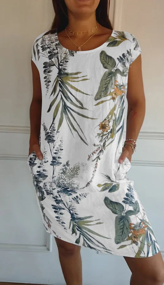 White botanical print midi dress on model facing forward