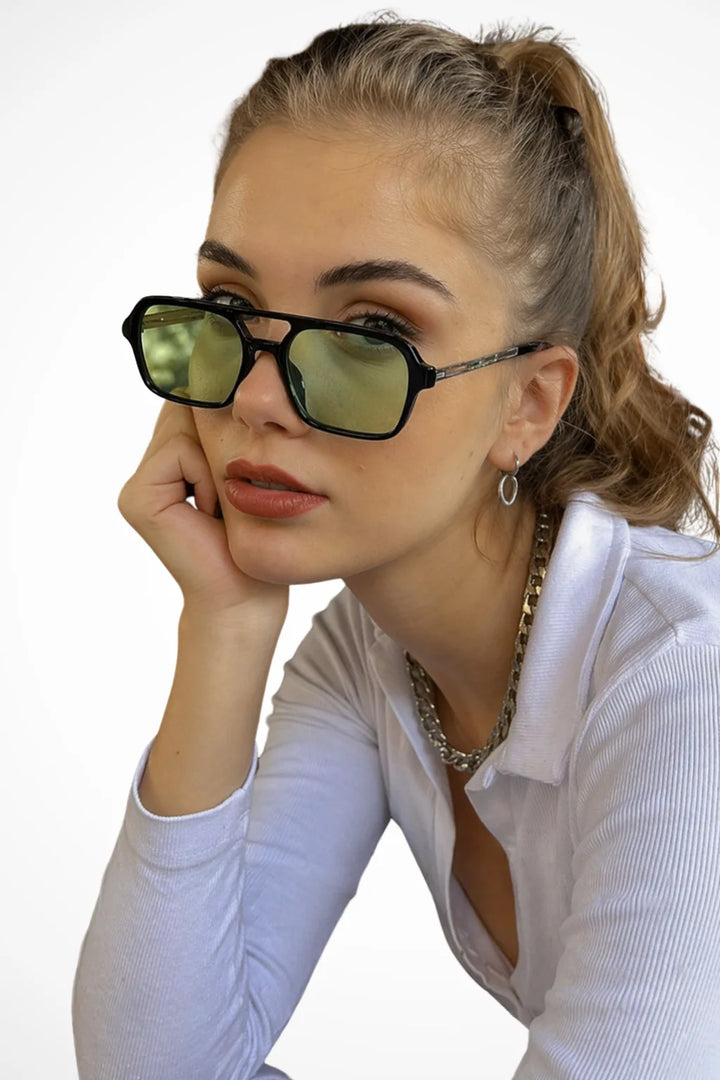 Square double bridge sunglasses with black frames and green lenses, front view