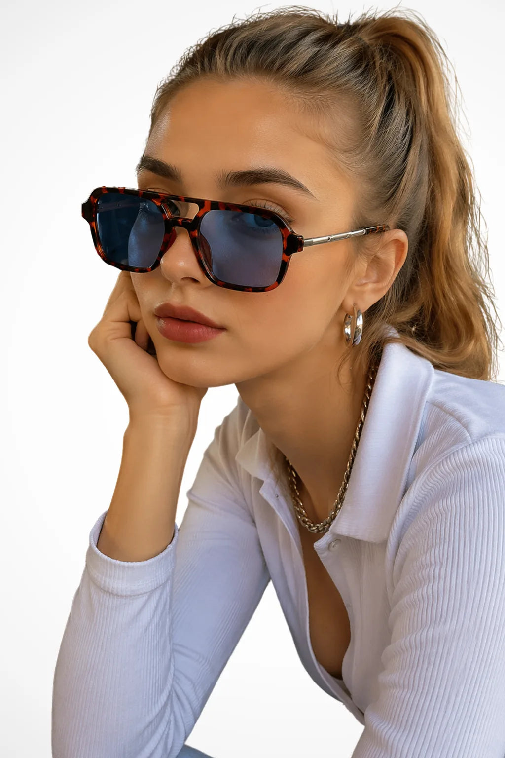 Square double bridge sunglasses with leopard print frames and blue lenses, front view
