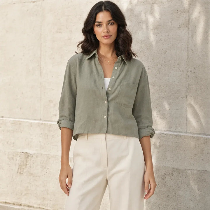 Cropped dark green button-down shirt on model in contrapposto stance
