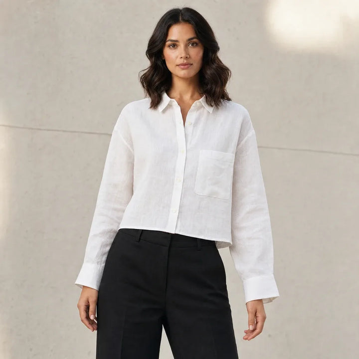 Cropped white button-down shirt on model in contrapposto stance