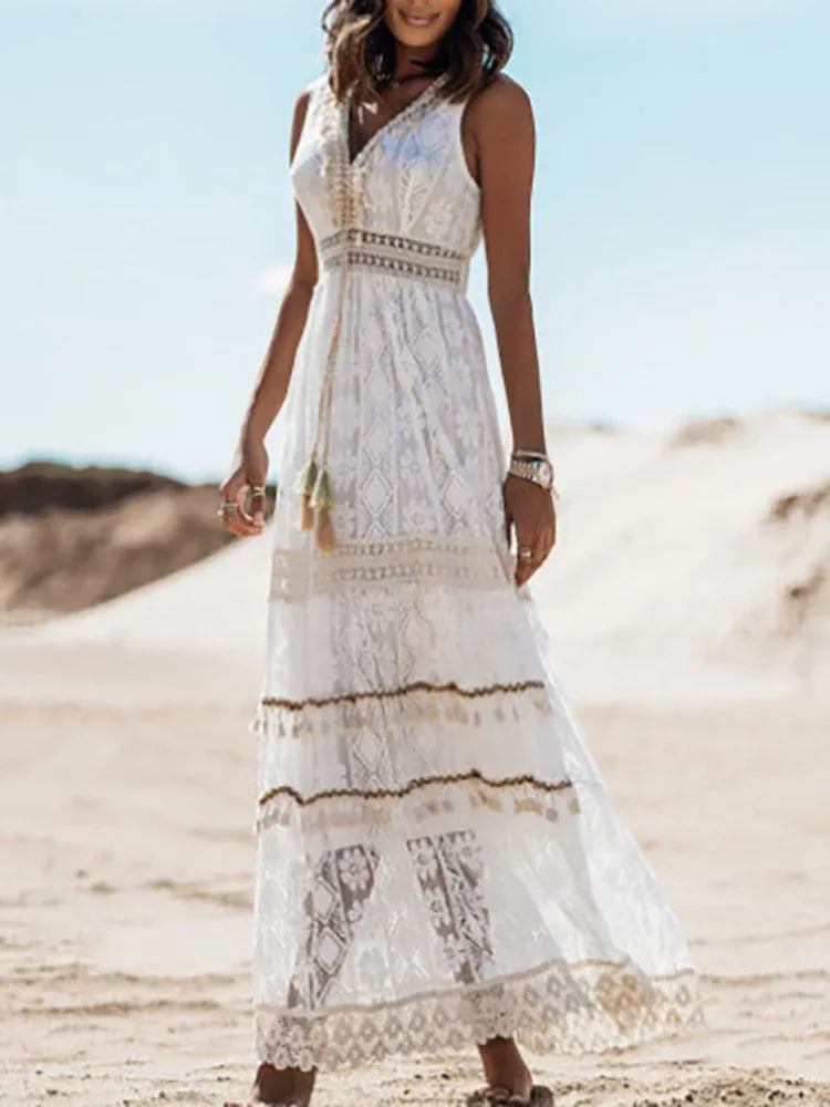 Close-up detail of beige lace tiered maxi dress fabric and tiers