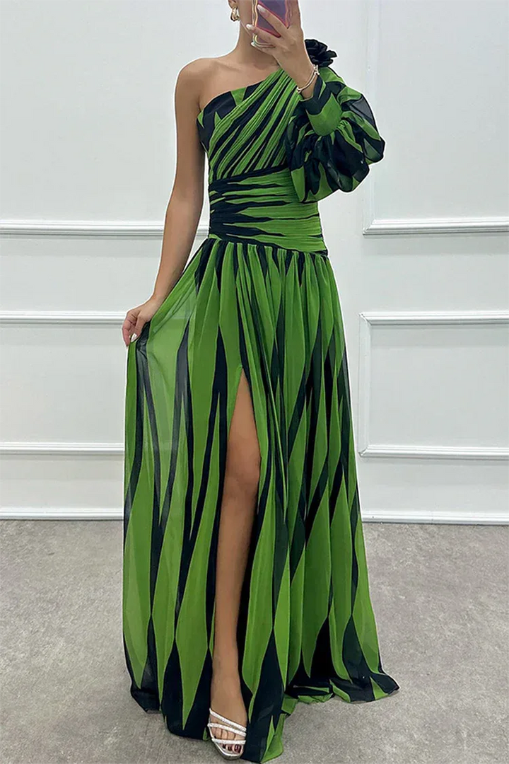 Woman in a green one-shoulder slit gown, full-length standing pose