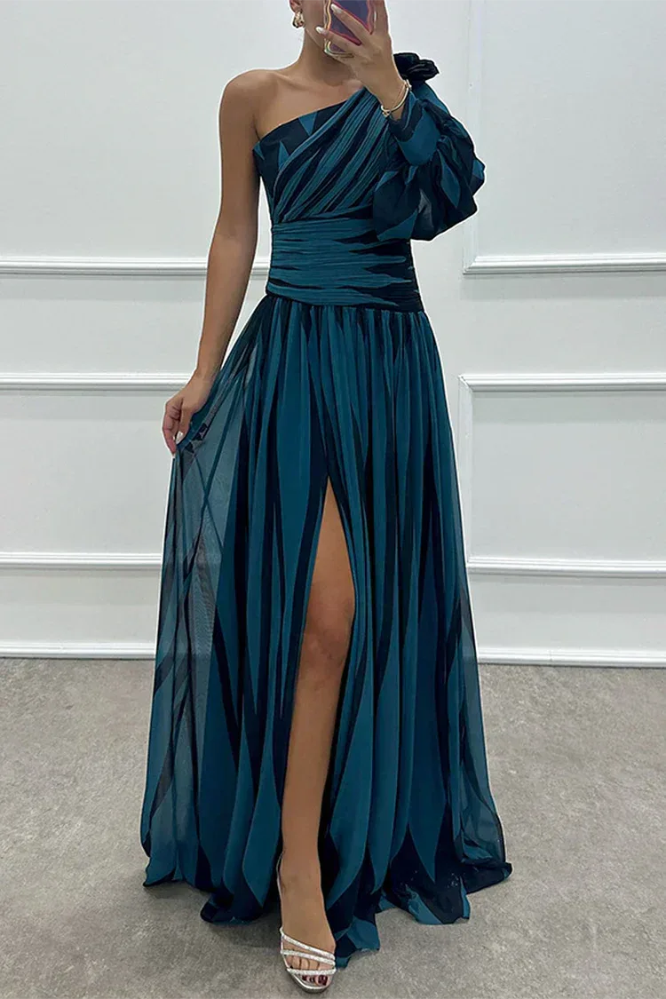 Woman in a navy blue one-shoulder floor-length gown with a front leg slit