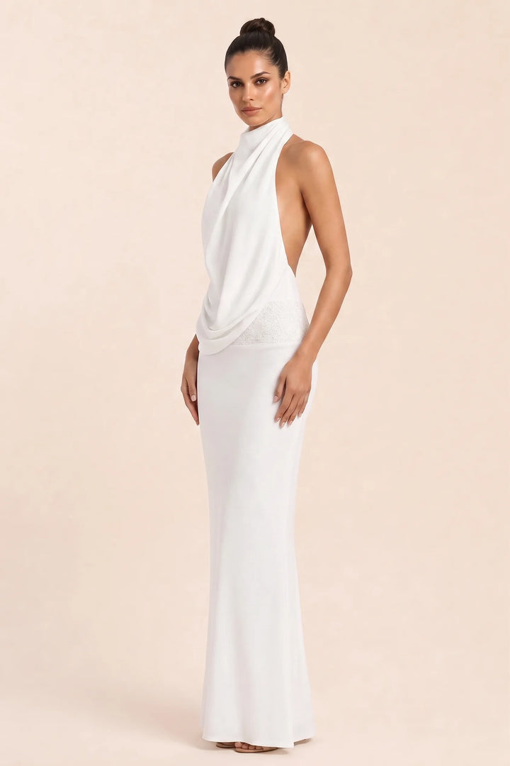 White draped open-back gown on model in three-quarter turn