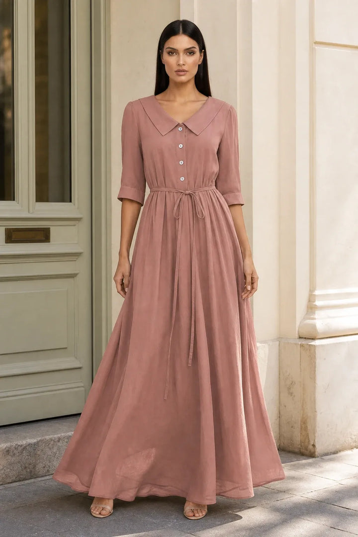 Light brown tie waist midi dress on model in contrapposto stance