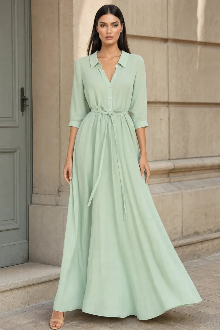 Light green tie waist midi dress on model in contrapposto stance
