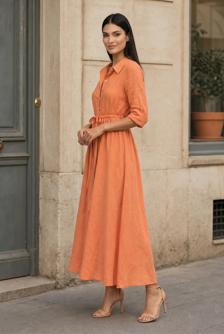 Orange tie waist midi dress on model in three-quarter turn
