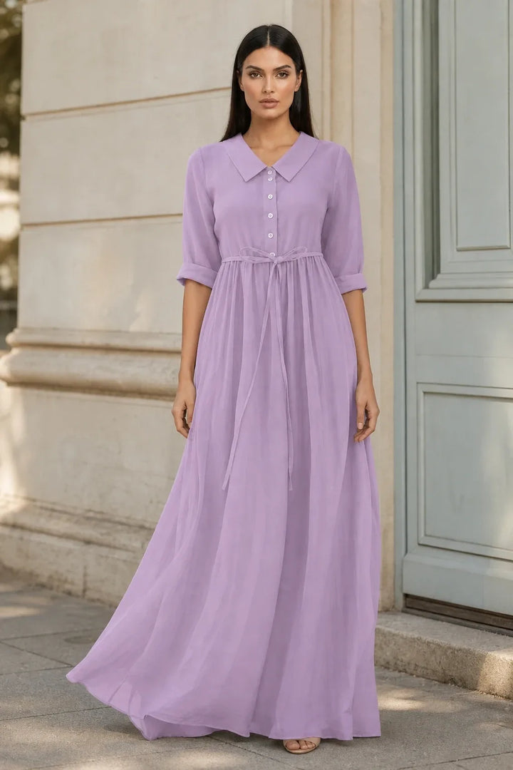 Purple tie waist midi dress on model in contrapposto stance