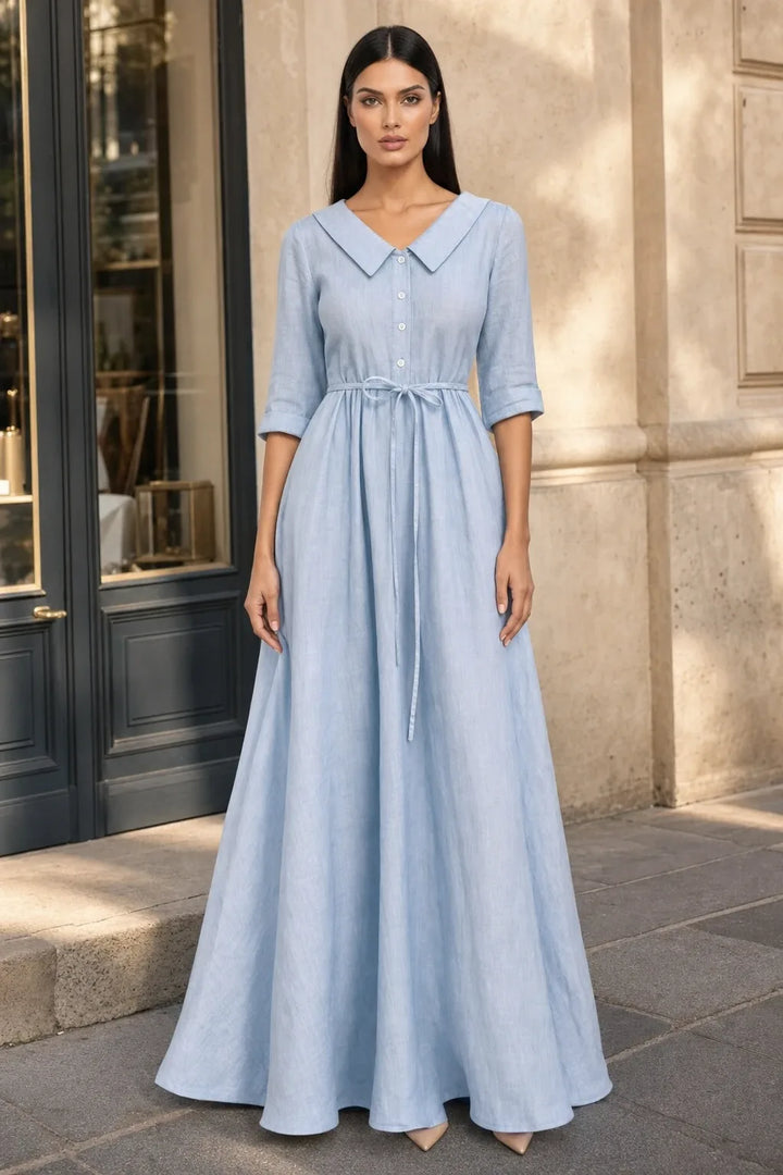 Sky blue tie waist midi dress on model in contrapposto stance