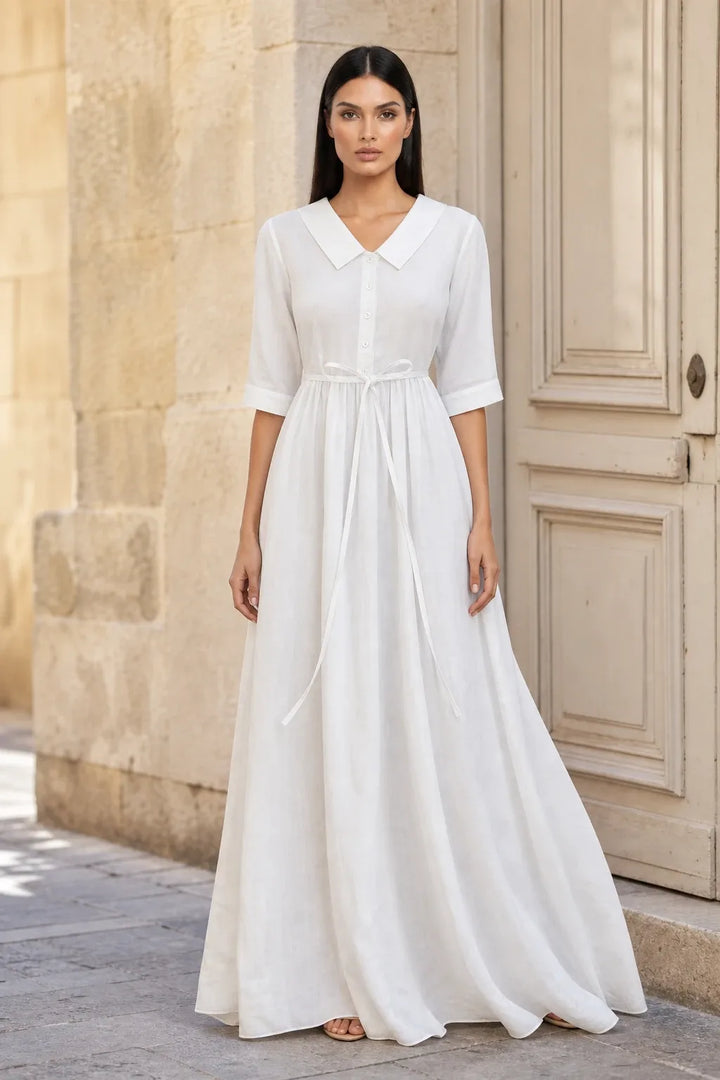 White tie waist midi dress on model in contrapposto stance