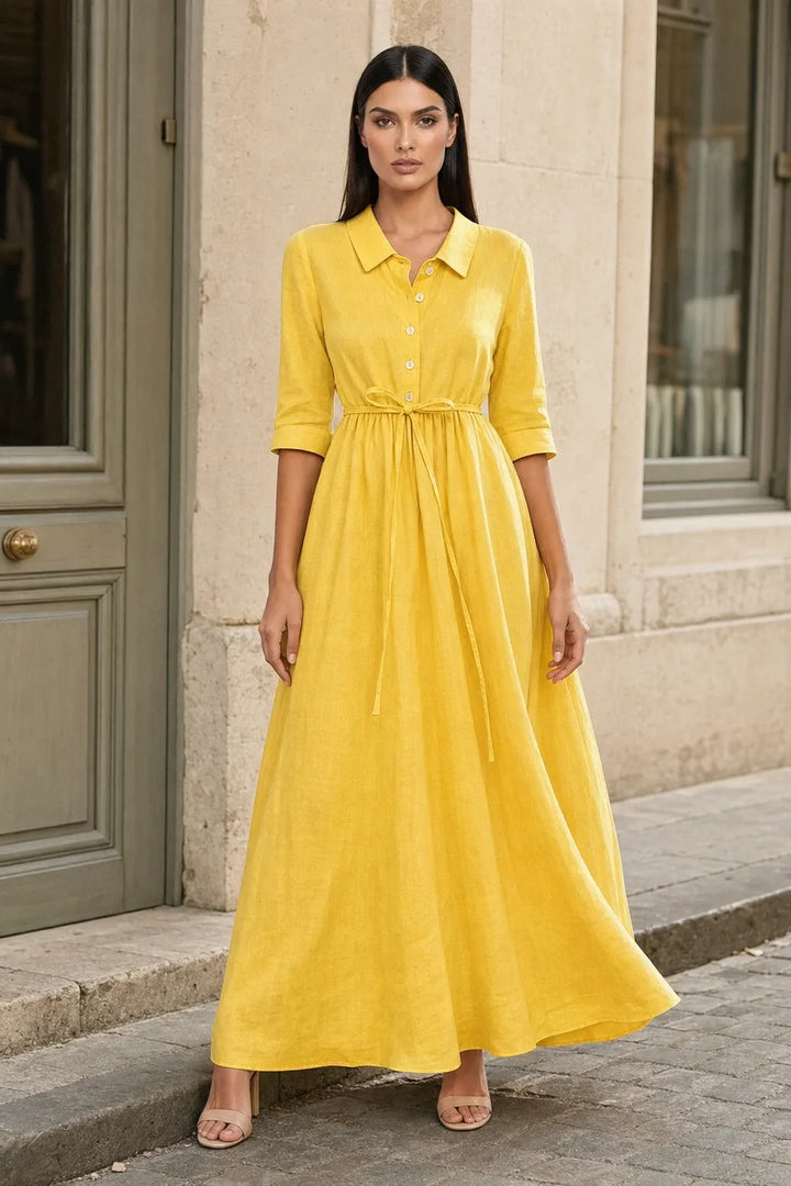 Yellow tie waist midi dress on model in contrapposto stance