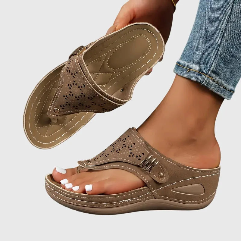 Brown wedge thong sandal, side profile highlighting elevated wedge heel