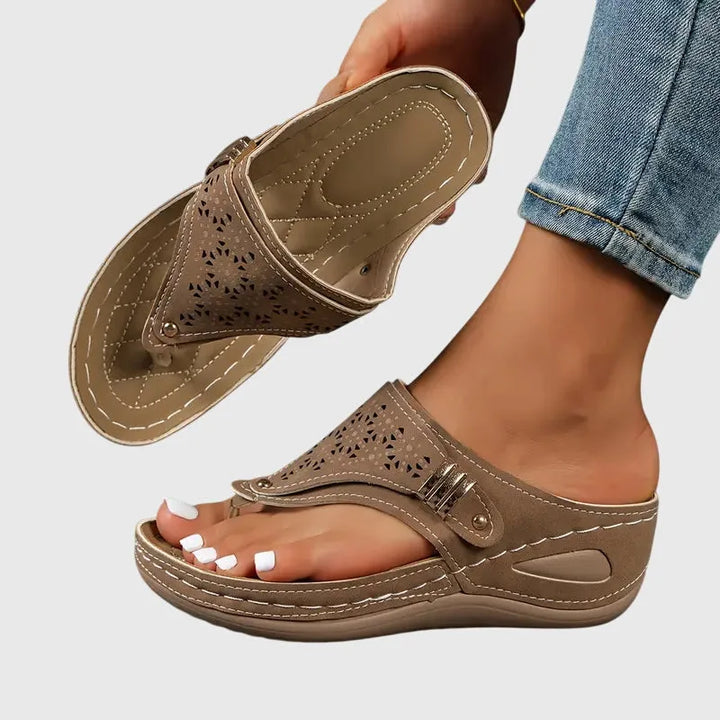 Brown wedge thong sandal, side profile highlighting elevated wedge heel