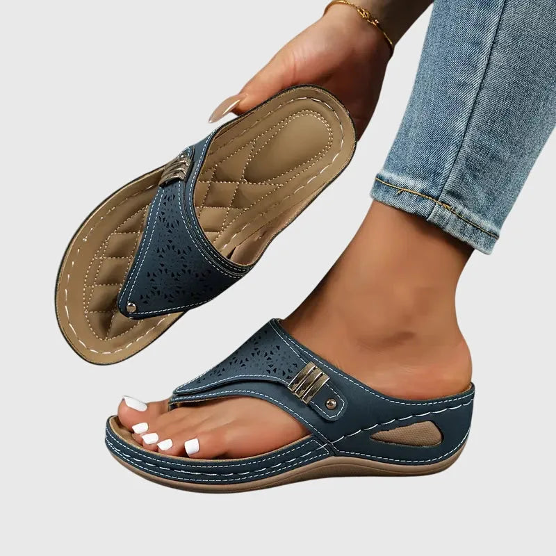 Navy wedge thong sandal, three-quarter angle view of strap and wedge
