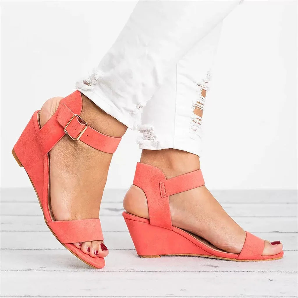 Pink ankle strap wedge sandal, three-quarter view