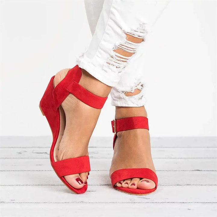 Red ankle strap wedge sandal, side profile view