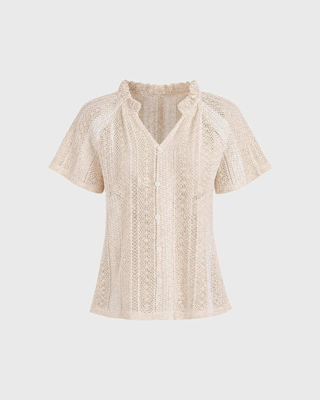 Woman in three-quarter turn wearing an apricot ruffle-neck crochet blouse
