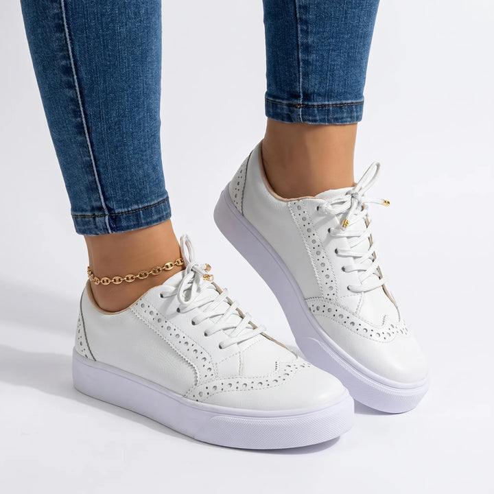White flatform brogue sneaker, front view