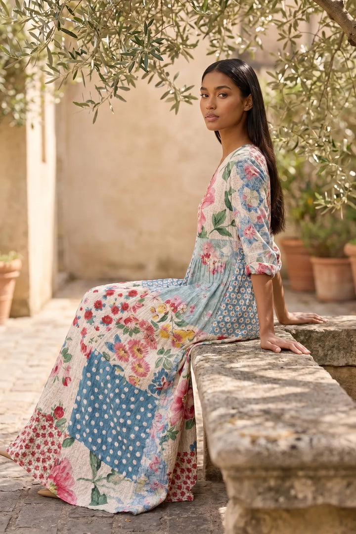 Model wearing light blue patchwork floral maxi dress in outdoor lifestyle setting