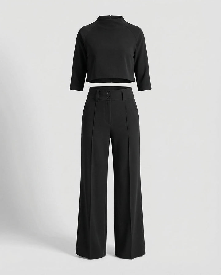 Woman wearing a black wide-leg trouser co-ord set with matching blazer