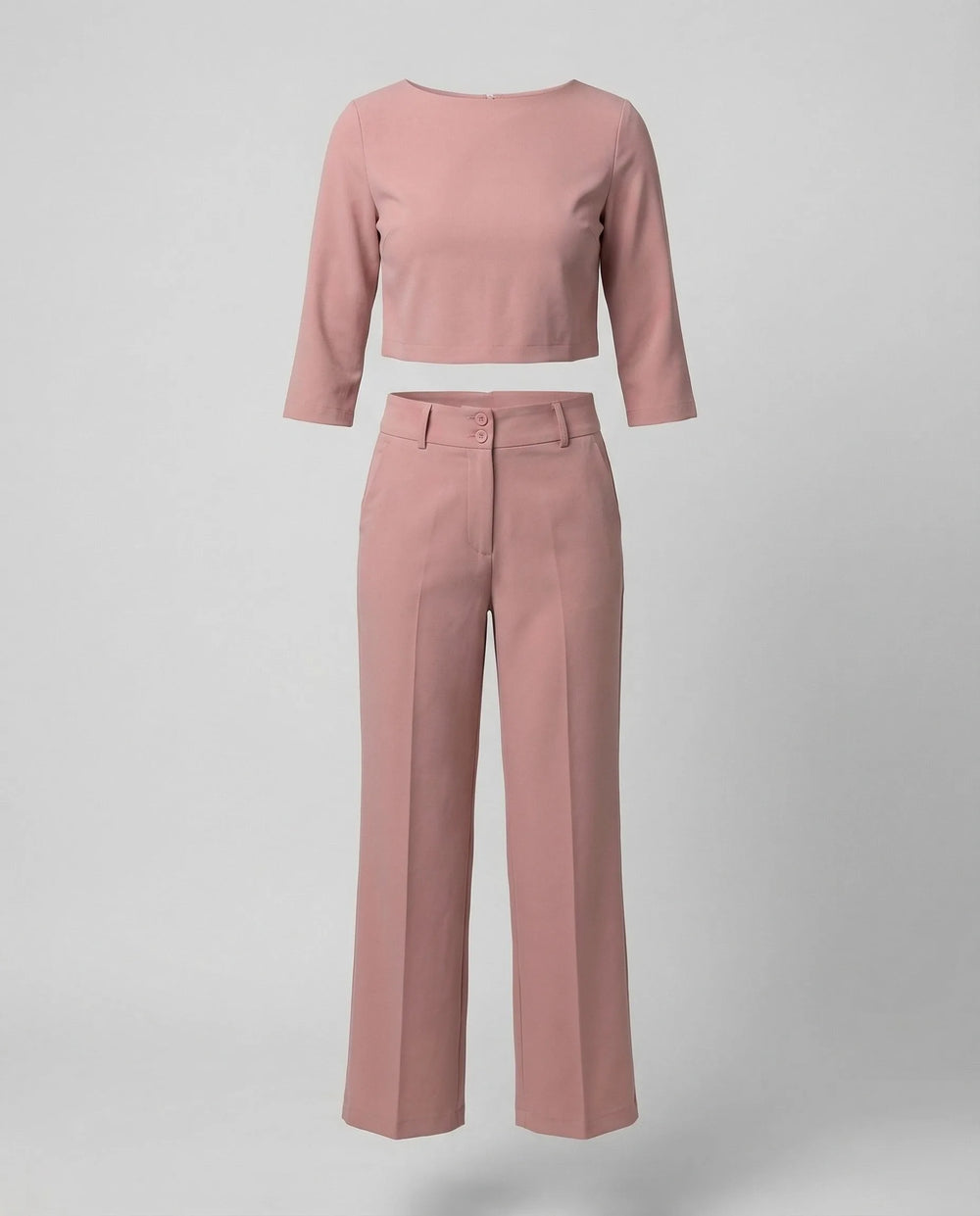 Close-up detail of pink wide-leg trousers and blazer fabric and fit
