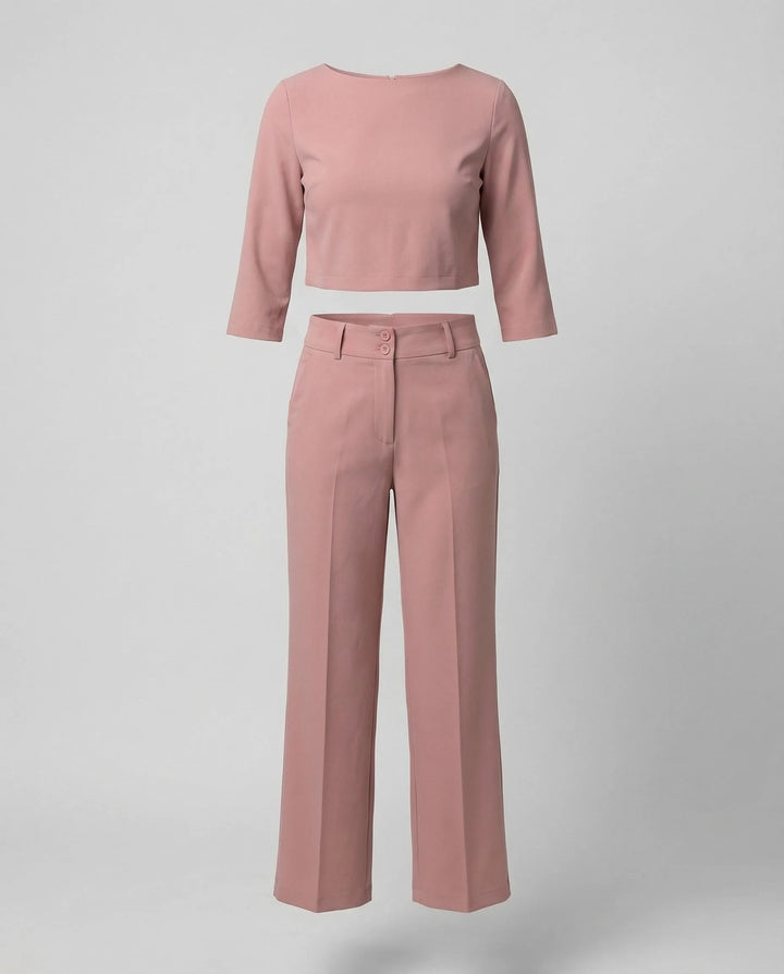 Close-up detail of pink wide-leg trousers and blazer fabric and fit