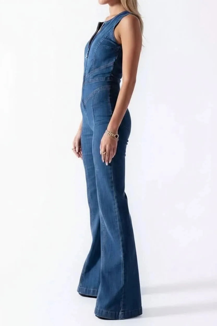 Model at three-quarter turn showing deep V neckline and flared leg jumpsuit