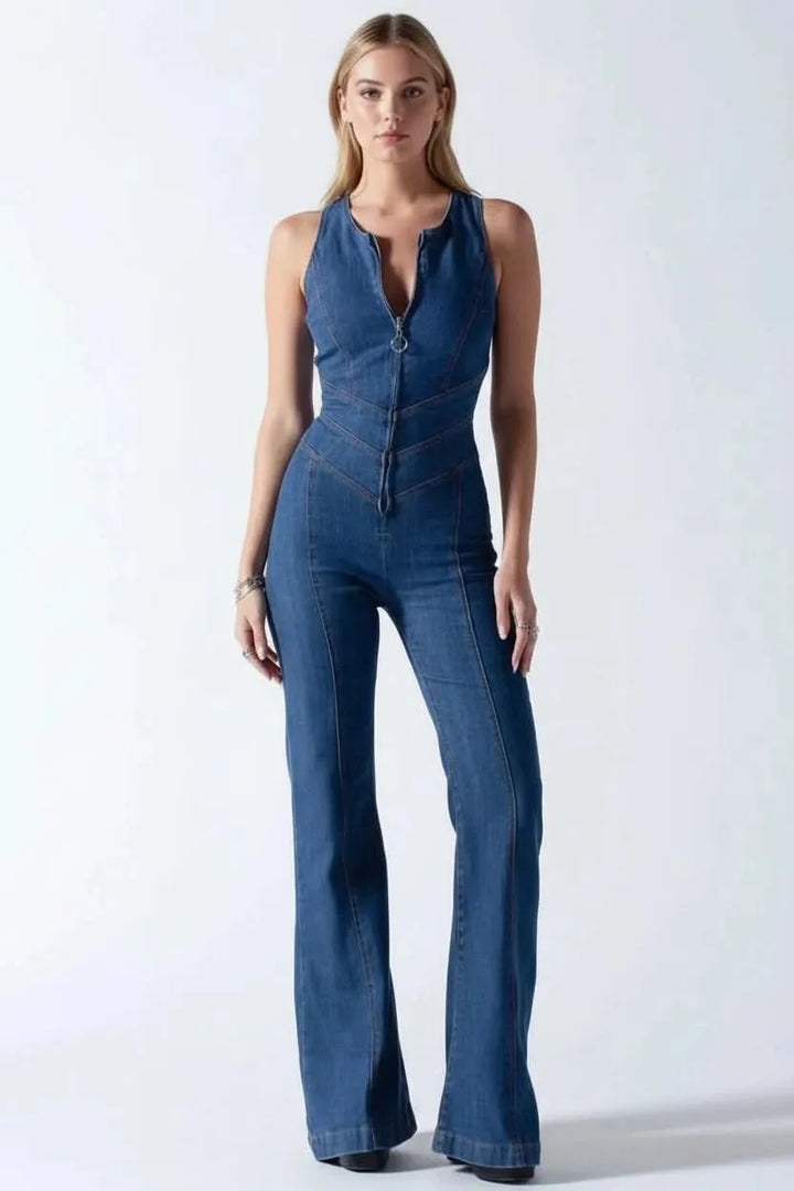 Model in a flared jumpsuit with deep V front, styled for a full-look view