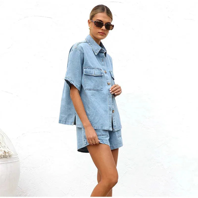 Model in a blue denim shirt co-ord set, seated or styled pose