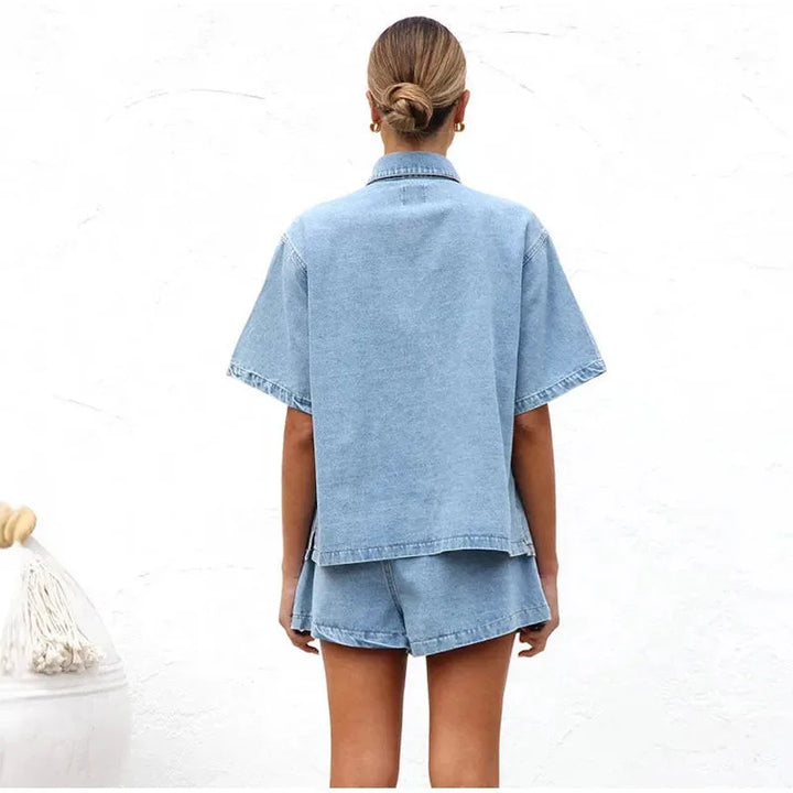 Close-up of model wearing a blue denim shirt co-ord set
