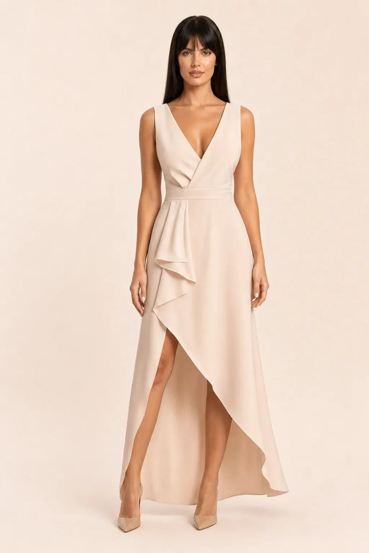 Apricot ruffle asymmetric midi skirt on model in contrapposto stance