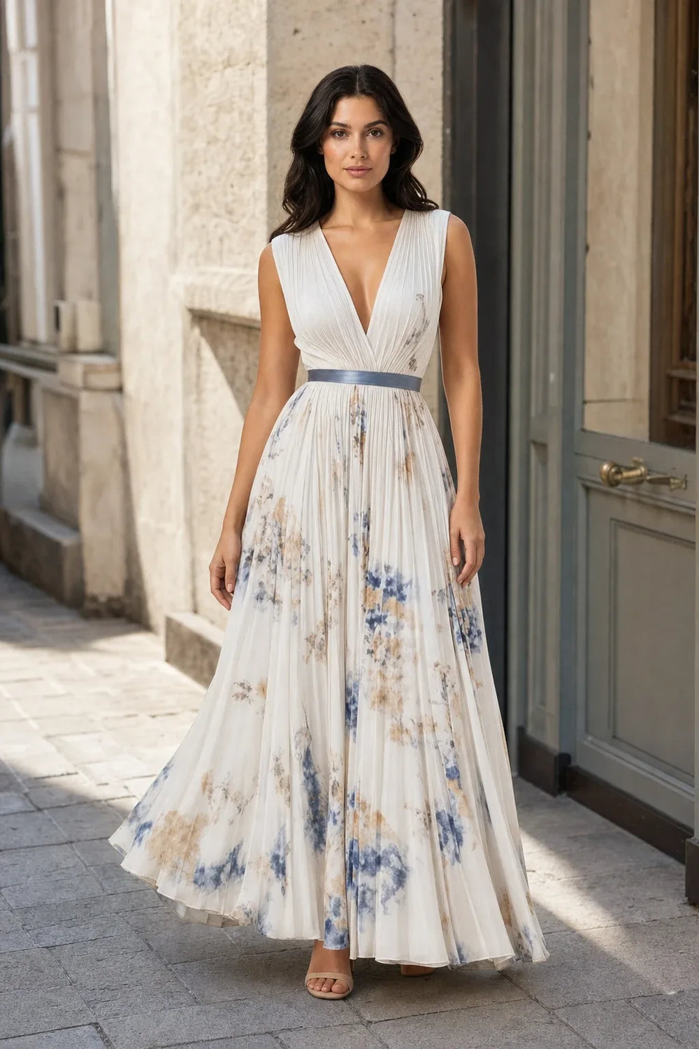 Beige pleated floral midi dress on a model in a contrapposto stance
